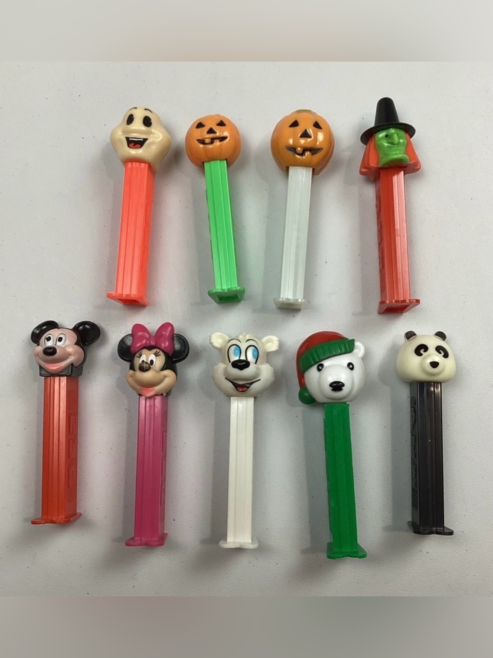 9 Vintage PEZ Dispensers with feet